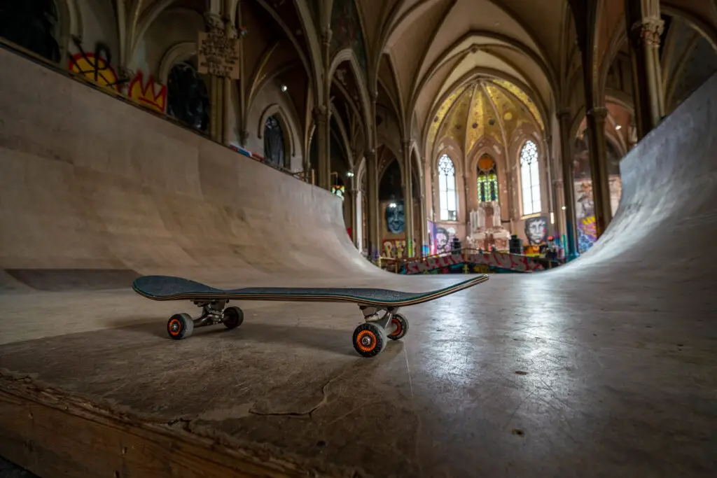 A skateboard sits on a halfpipe in the former church