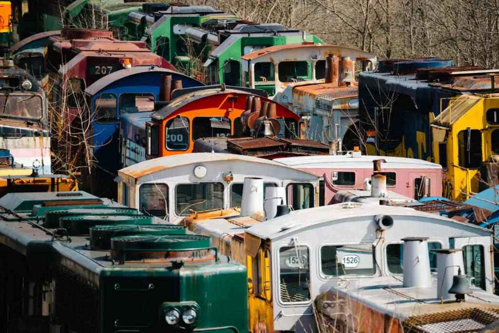 train cars sit rusting away at Larry's Truck & Electric
