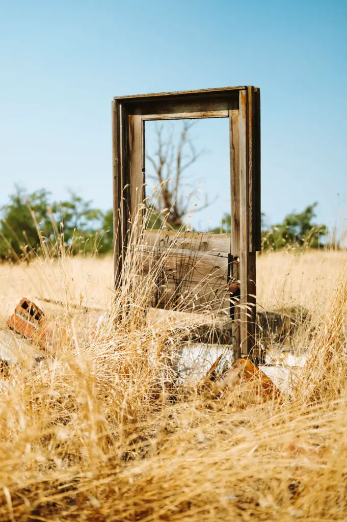 lonely door in field in ordnance ghost town oregon